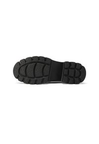 Sole in gomma nera con superficie textured, dotata di un motivo di battistrada e una sezione della punta arrotondata. Inclusa area del tallone rinforzata.