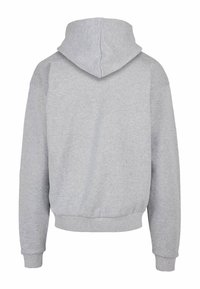 Gray sweatshirt with a hood, featuring a relaxed fit, ribbed cuffs, and hem. Made of soft, textured cotton blend fabric. No visible logos.