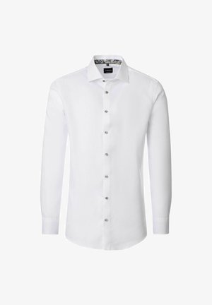 Witte langemouw shirt met een knoopsluiting aan de voorkant, zilveren knopen en een bloemenpatroon onder de kraag. Gladde katoen stof.