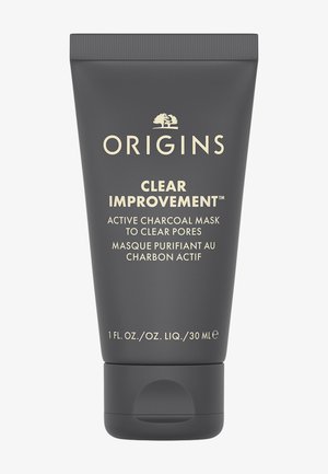 Grijze tube van Origins Clear Improvement actieve houtskoolmasker, met gouden tekst en een afgeronde flip-top dop, 30 ml formaat.