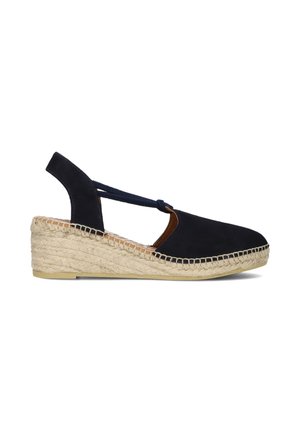 Marineblauwe sleehak espadrille met gesloten neus, slingback bandje en geweven jutemiddenzool en buitenzool.