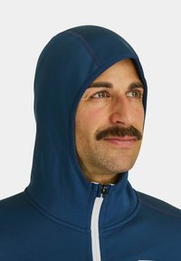 Navy blue hooded top made of smooth fabric, featuring a high collar, front zipper, and contrasting white zipper accent.