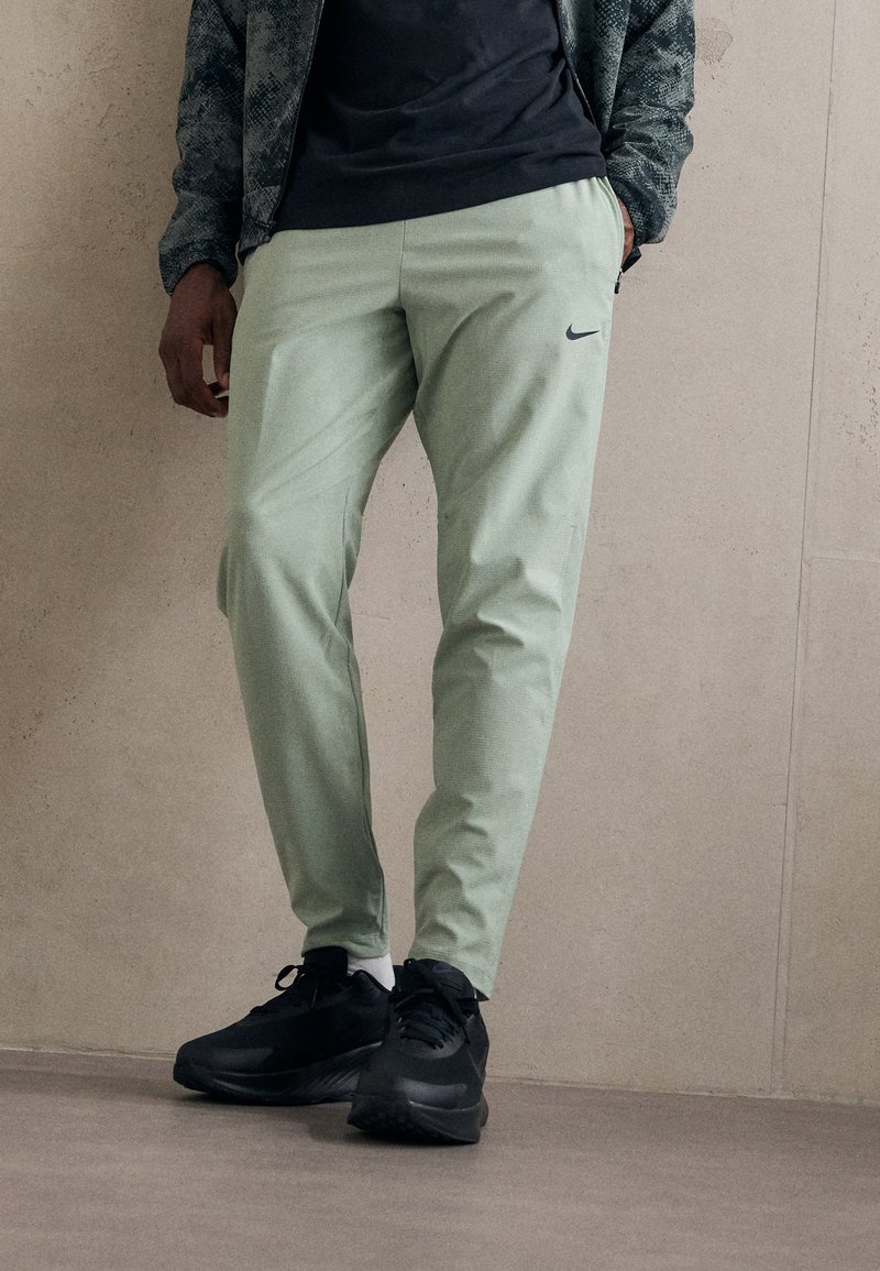 Nike Performance FLEX REP - Tepláky - jade horizon