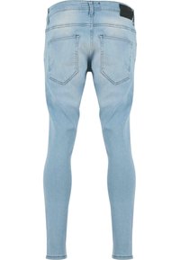 Hele sinise värviga kitsad teksapüksid, mis on valmistatud denimist, sileda tekstuuriga, viie taskuga ja erilise nahast tagumise vöökohatükiga.