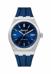 Zegarek automatyczny Ingersoll z ciemnoniebieską tarczą, srebrną stalową kopertą i niebieskim gumowym paskiem. Posiada okno daty oraz srebrne indeksy godzinowe.