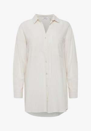 Lys beige langærmet skjorte med subtile lodrette striber, to forlommer, knappelukning og en afslappet pasform. Blødt stof.