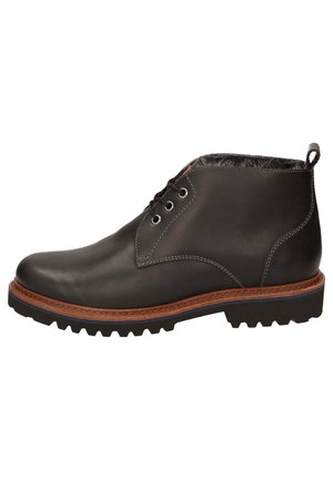 Botte à chevilles en cuir noir avec bout rond, deux œillets pour les lacets, semelle intermédiaire marron, semelle en caoutchouc texturée et tirette à l'arrière.