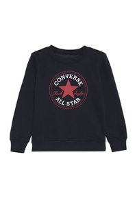 Felpa navy con un logo rotondo rosso che presenta una stella, il testo "Converse All Star" e "Chuck Taylor", polsini e scollo a costine.