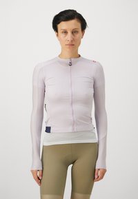 Light purple long-sleeve cycling jersey with a front zipper, textured fabric, and mesh panel at the bottom. Features a navy accent and fitted design.