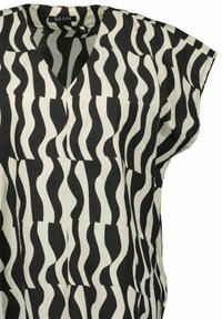 Tunic bianca e nera con motivo ondulato, scollatura a V e maniche corte. Realizzata in tessuto leggero con una vestibilità comoda.