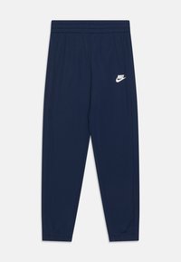 Tumši zili Nike sporta bikses ar elastīgu jostu, slaidu piegriezumu, sašaurinātām kājām un baltu logotipa detaļu kreisajā pusē. Mīksts, viegls materiāls.