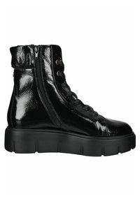 Bottine noire brillante à lacets avec fermeture éclair latérale et semelle épaisse rainurée, conçue pour un usage décontracté ou mode.