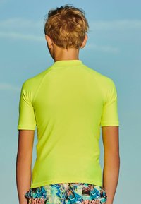 Next SHORT SLEEVE SUNSAFE  - Surfshirt - yellow