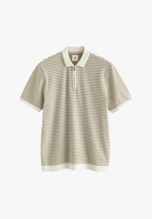 Polo de manga corta en color crema con rayas horizontales marrones, con cremallera en la parte delantera y detalles en color blanco sólido en el cuello y el dobladillo. Material de mezcla de algodón.
