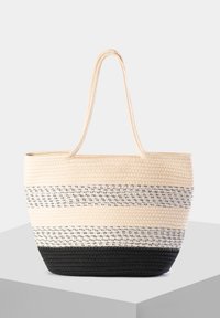 Duża pleciona torba tote w beżowe, czarne i białe paski. Posiada solidne uchwyty i miękką, teksturowaną tkaninę.