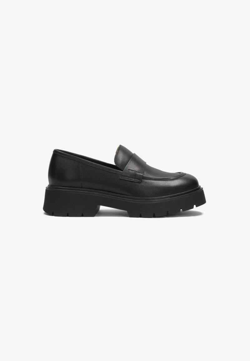 Black leather loafers with a low, chunky sole. Features a smooth finish and raised stitching detail on the toe. Slip-on design.