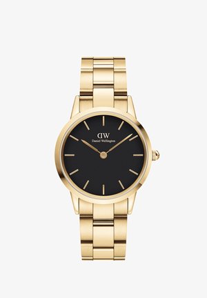 Goldfarbene Armbanduhr mit schwarzem Zifferblatt, minimalistischen Stundenmarkierungen, leuchtenden Zeigern und einem Gliederarmband-Design.
