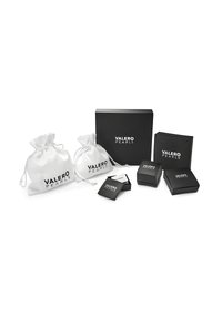 Black and white packaging including two white fabric pouches and multiple black boxes, all featuring "VALERO PEARLS" branding.