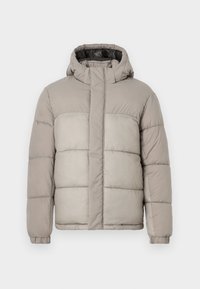 Dunjakke i lys grå med hette, har quiltet design, frontdragkedje og elastiske mansjetter, laget av myk, teksturert stoff.