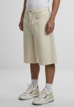 JUNAN BAGGY BASIC - Denim shorts - beige