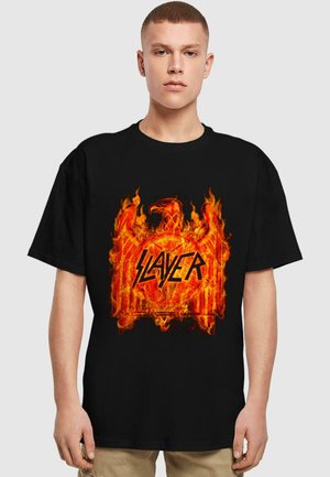 Black t-shirt featuring a large, vibrant orange and red graphic of flames and an eagle with the text "SLAYER" in a jagged font.