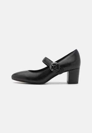 Schwarze Leder-Mary-Jane-Schuhe mit einer runden Spitze, einem Riemen mit einer runden Schnalle und einem klobigen Absatz. Glatte Textur und elegantes Design.