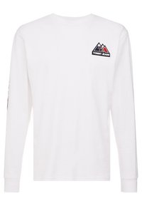 Vit långärmad t-shirt i bomull med en triangulär logotyp på vänster bröst och en grafik på vänster ärm.