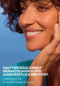 Close-up of a person's face with curly dark hair, smooth skin, and a natural smile. Text mentions dermatological compatibility and suitability for contact lens wearers.
