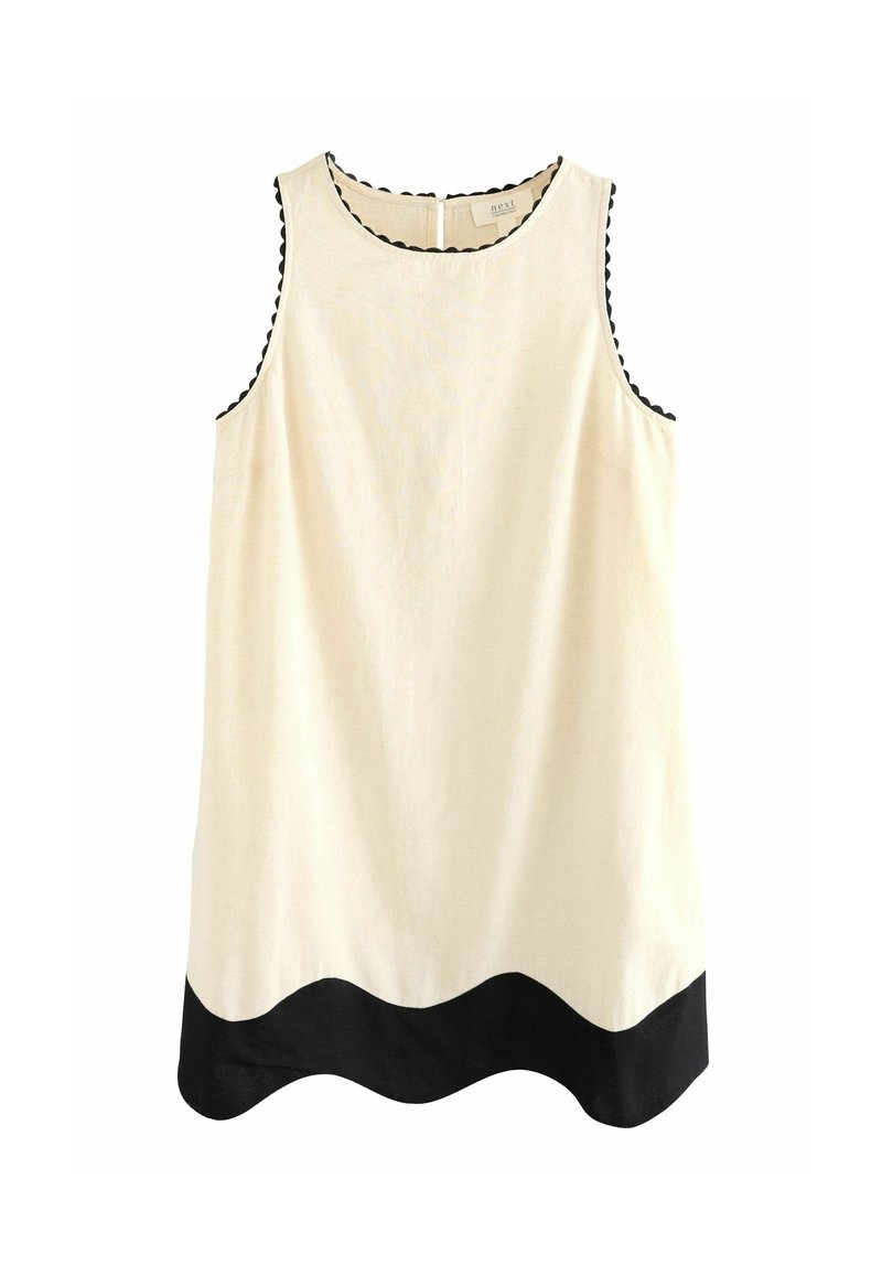 Robe crème sans manches avec un bord festonné noir autour des emmanchures et de l'encolure, et un ourlet noir ondulé en bas.
