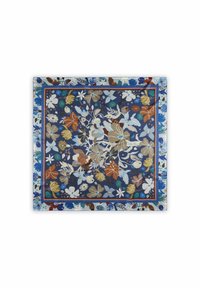 Motif floral coloré sur un fond bleu profond, bordé de motifs complexes en orange et en turquoise, créant un effet visuel vibrant.