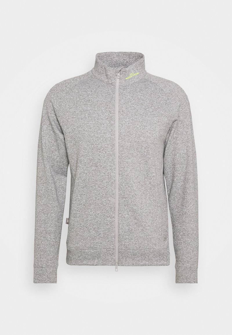 Veste gris clair à fermeture éclair intégrale, manches longues, col montant, avec un discret logo néon près de l'encolure sur le côté gauche.