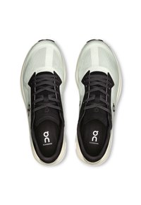 Light mint running shoes with a breathable mesh upper, black laces, and logo on the tongue. Cushioned sole adds comfort and support.
