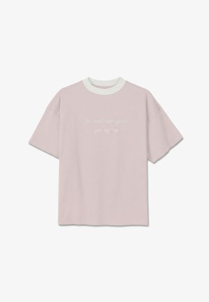 Light pink short-sleeve t-shirt with white collar and white cursive text centered reading, "You can't take your eyes off me."