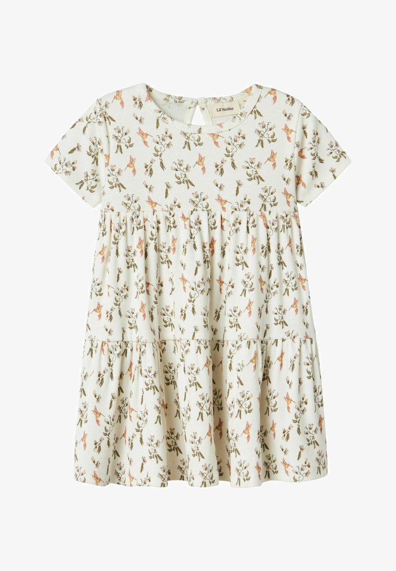 Kortermet, lys farget kjole med blomstermønster, lagdelt design og nøkkelhull-ryggrad. Laget av ribbestrikket stoff, egnet for varmt vær.