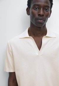 Massimo Dutti Poloshirt - light yellow