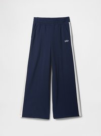Navy wide-leg pants with elastic waistband, side pockets, and white side stripes. Features "GAP" logo on the front. Soft fabric texture.