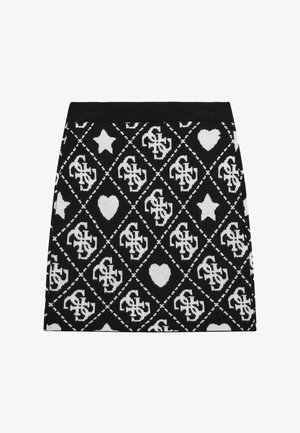 Jupe mini tricotée avec un motif en losanges noir et blanc, ornée de cœurs et d'étoiles, et dotée d'une taille côtelée en haut.