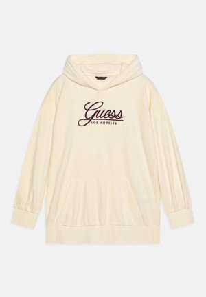 Kremfarvet fløjls-hoodie med frontlomme og "Guess Los Angeles" skrevet i mørkerødt på brystet.