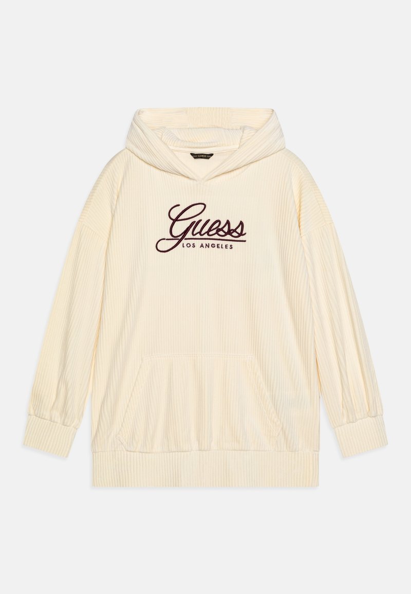 Sweat à capuche en velours côtelé couleur crème avec poche kangourou à l'avant et logo "Guess Los Angeles" écrit en rouge foncé sur la poitrine.