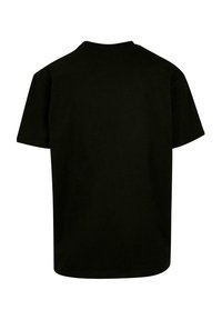Svart bomull T-skjorte med rund hals og korte ermer. Har en ensfarget bakside uten synlige logoer eller design. Myk tekstur.
