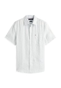 Chemise à manches courtes à boutons en tissu léger, avec un fond blanc et un petit motif floral dans des nuances de bleu et de vert.