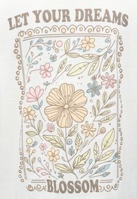Λουλουδένιο σχέδιο με παστέλ ροζ, μπλε και κίτρινα λουλούδια και πράσινα φύλλα, περιτριγυρισμένο από μια στιλιζαρισμένη κουκκίδα, με κείμενο «ΑΦΗΣΤΕ ΤΑ ΟΝΕΙΡΑ ΣΑΣ ΝΑ ΑΝΘΙΣΟΥΝ».