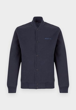 Veste bleu marine à boutons, manches longues, poignets et ourlet côtelés, avec petit logo bleu « PS Paul Smith » sur la poitrine gauche.