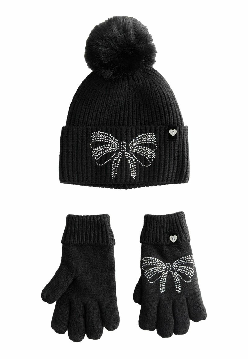 Black knit hat with a pom-pom and rhinestone butterfly design; paired with matching gloves featuring a similar butterfly accent.