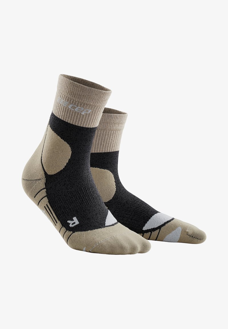 Knöchellange Socken mit einem dunkelgrauen Körper, beige und weißen Akzenten, gerippten Bündchen und speziellen Mustern für Komfort und Unterstützung.