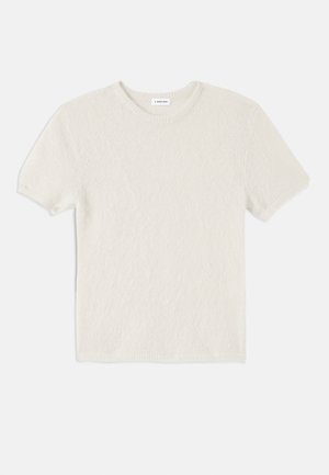 Short-sleeve crewneck t-shirt in cream, made from textured fabric. Features ribbed collar and sleeves, with a relaxed fit.
