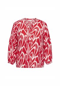 Röd och vit mönstrad blus med v-ringning, långa ärmar och avslappnad passform. Har ett geometriskt abstrakt mönster över hela plagget.