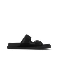 Svart öppet tå slide sandal med strukturerad ovandel, platt sula och minimalistisk design. Har ett enda rem över foten.
