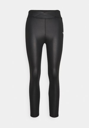 Czarne legginsy sportowe z wysokim, skrzyżowanym paskiem w talii. Wykonane z gładkiego, elastycznego materiału o dopasowanym kroju i długości do kostek.