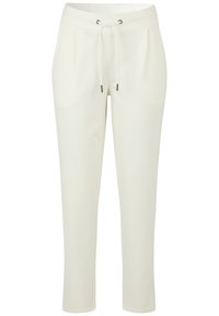 Witte sportbroek gemaakt van zachte stof, met een elastische tailleband met trekkoord, twee zijzakken en taps toelopende benen.